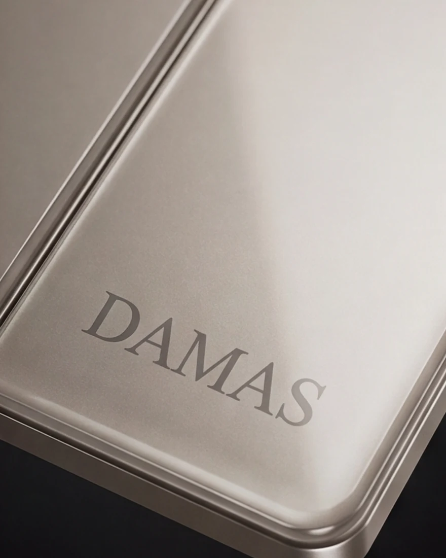 Brown glass face plate with the DAMAS mark